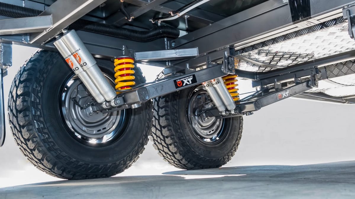 A New Age full off-road caravan travelling through remote Australia